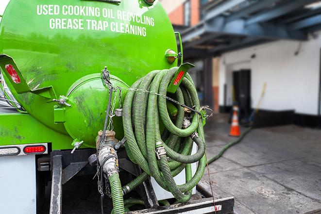 a large industrial grease trap being pumped out in Burlington MI